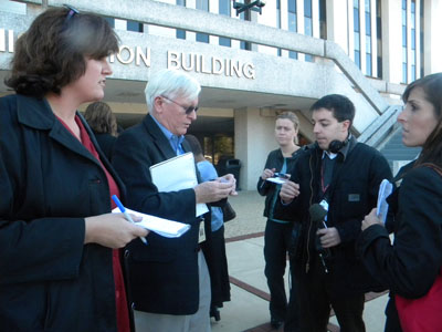James P. Keary (second from left) fields reporters questions outside the County Administration Building. Photo by Maryland Newsline's Tami Le