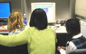 KidsTeam members read a book off the digital library